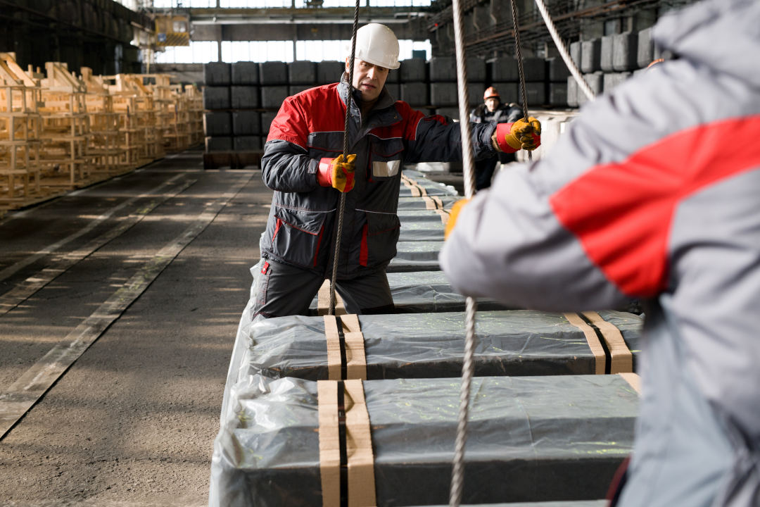 Workers Moving Materials Divider Trays for Automotive